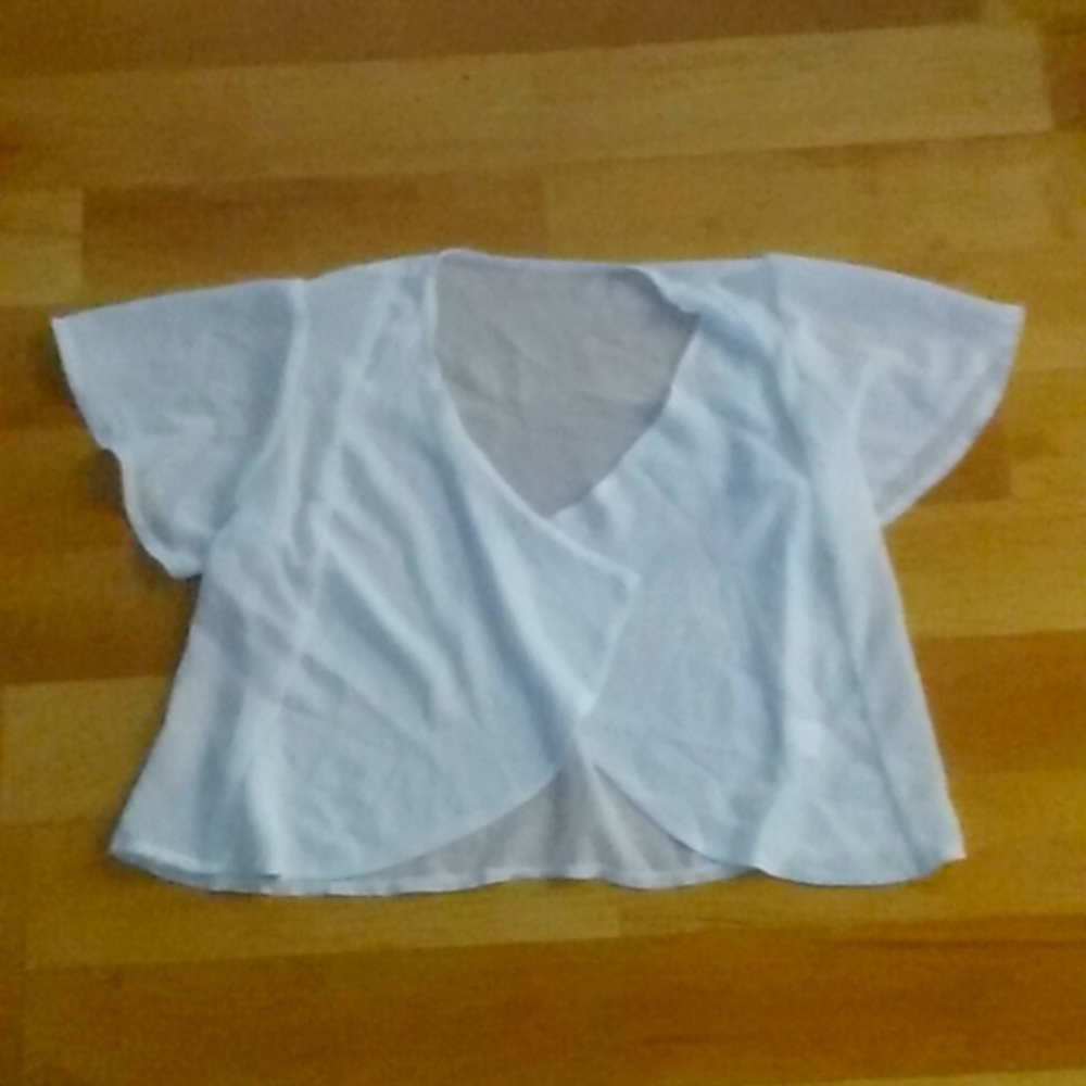 Dress shirt that goes over a shirt or a dress.